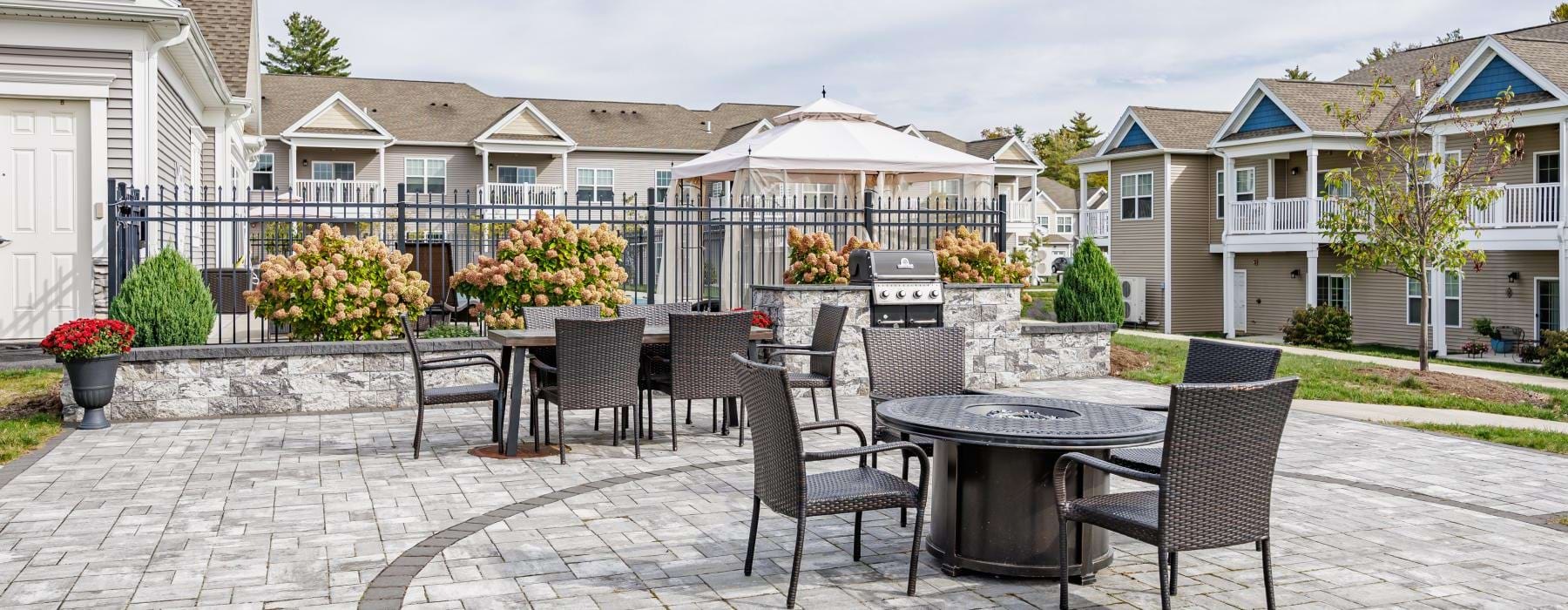 a patio with a table and chairs